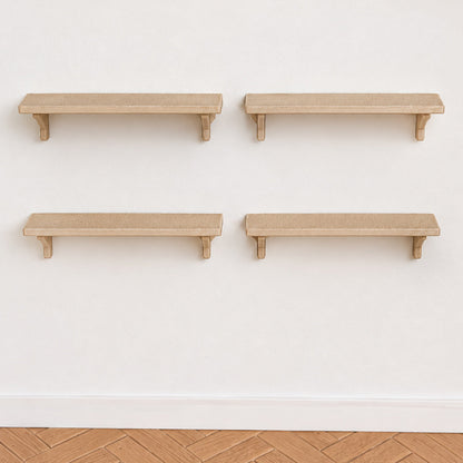 Set of 4 miniature wall shelves in light wood with bracket supports, mounted on a white wall above a herringbone floor
