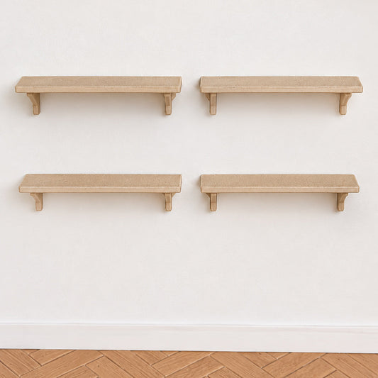 Set of 4 miniature wall shelves in light wood with bracket supports, mounted on a white wall above a herringbone floor