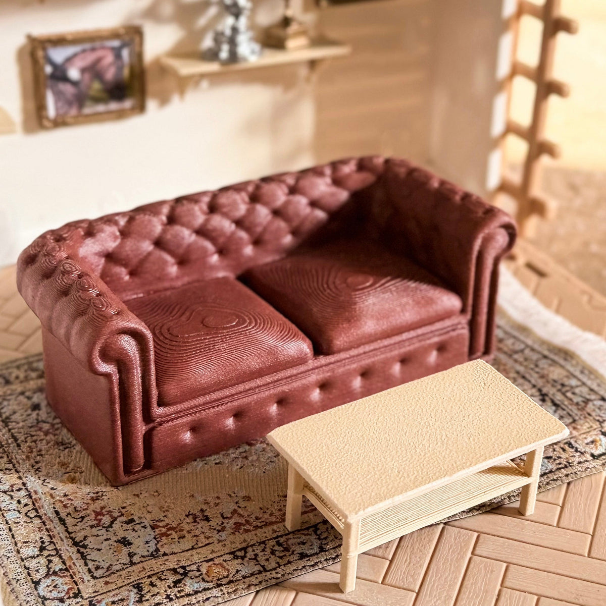 Burgundy tufted Chesterfield-style miniature couch with a light oak coffee table on a patterned rug, 3D printed for Schleich model horses